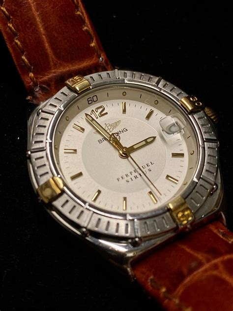 BREITLING 1884 Perpetuel Sirius Watch in Gold/Steel w/ Date .